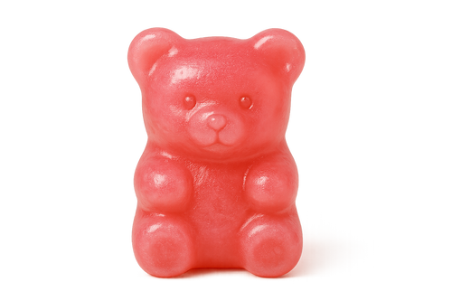 una gomita en forma de osito rosa con el fondo transparente 